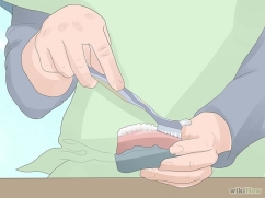 brushing dentures